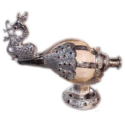 Sea Shell Conch decorated with silver plated carvings and studded with semi precious gem stones.